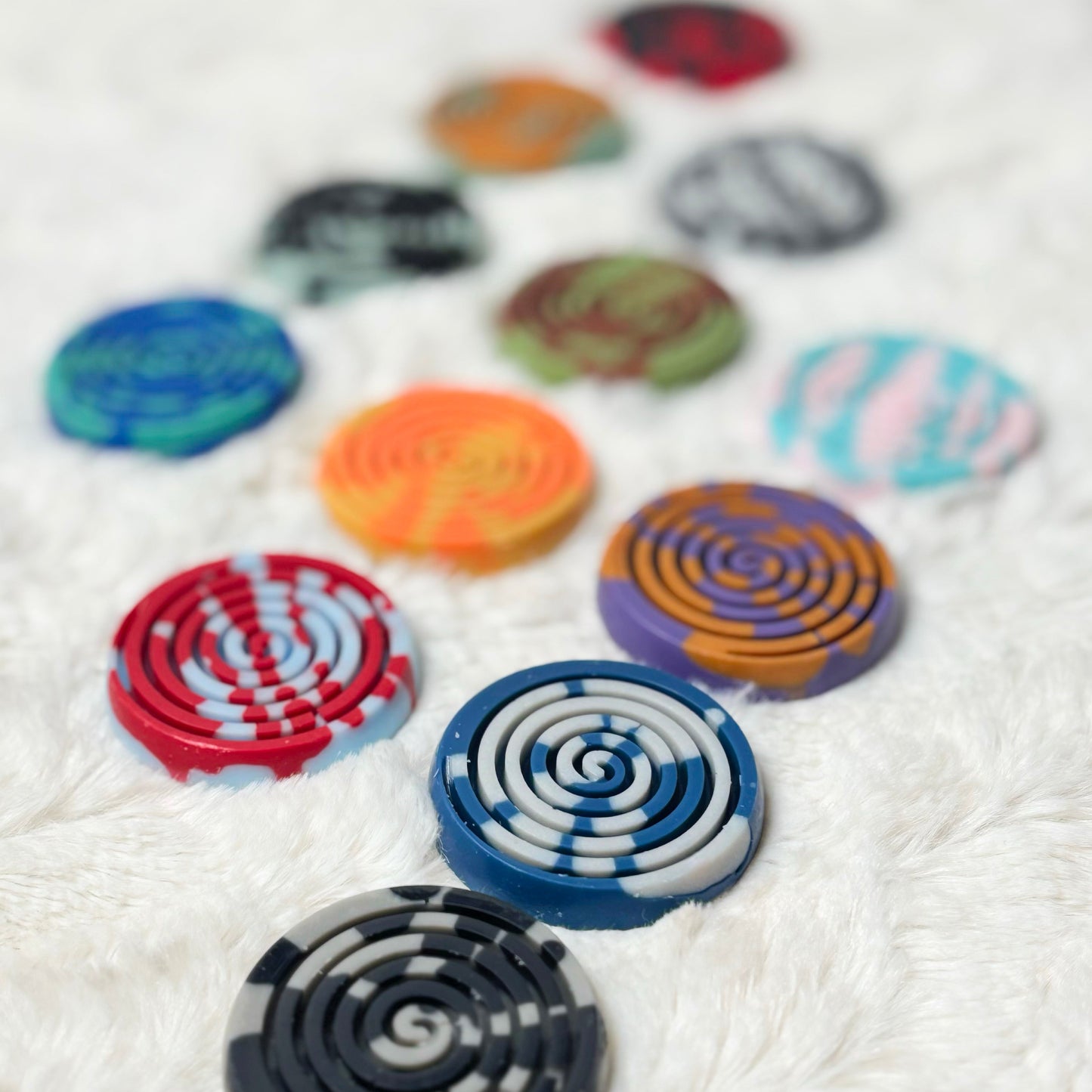 Colorful circular patterns on a white fabric background