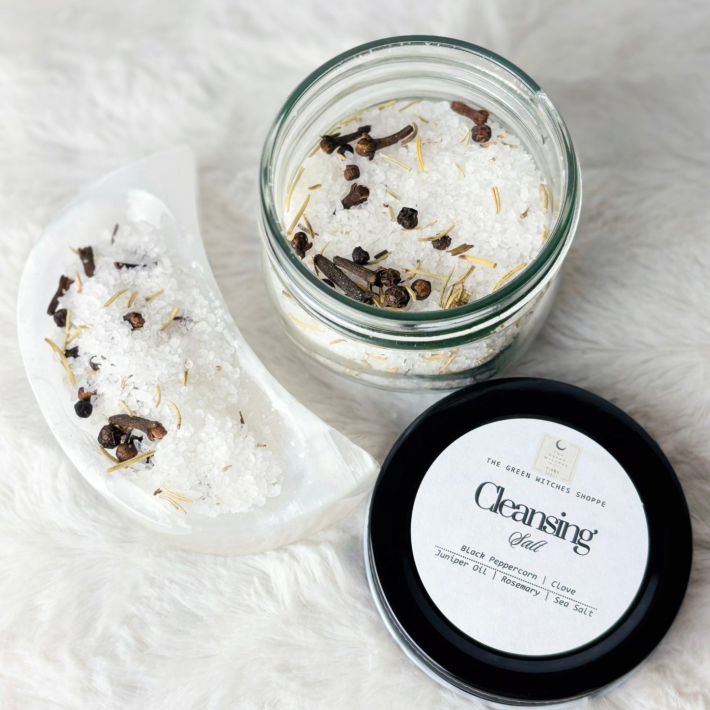 Cleansing salt with a jar and scoop on a white background