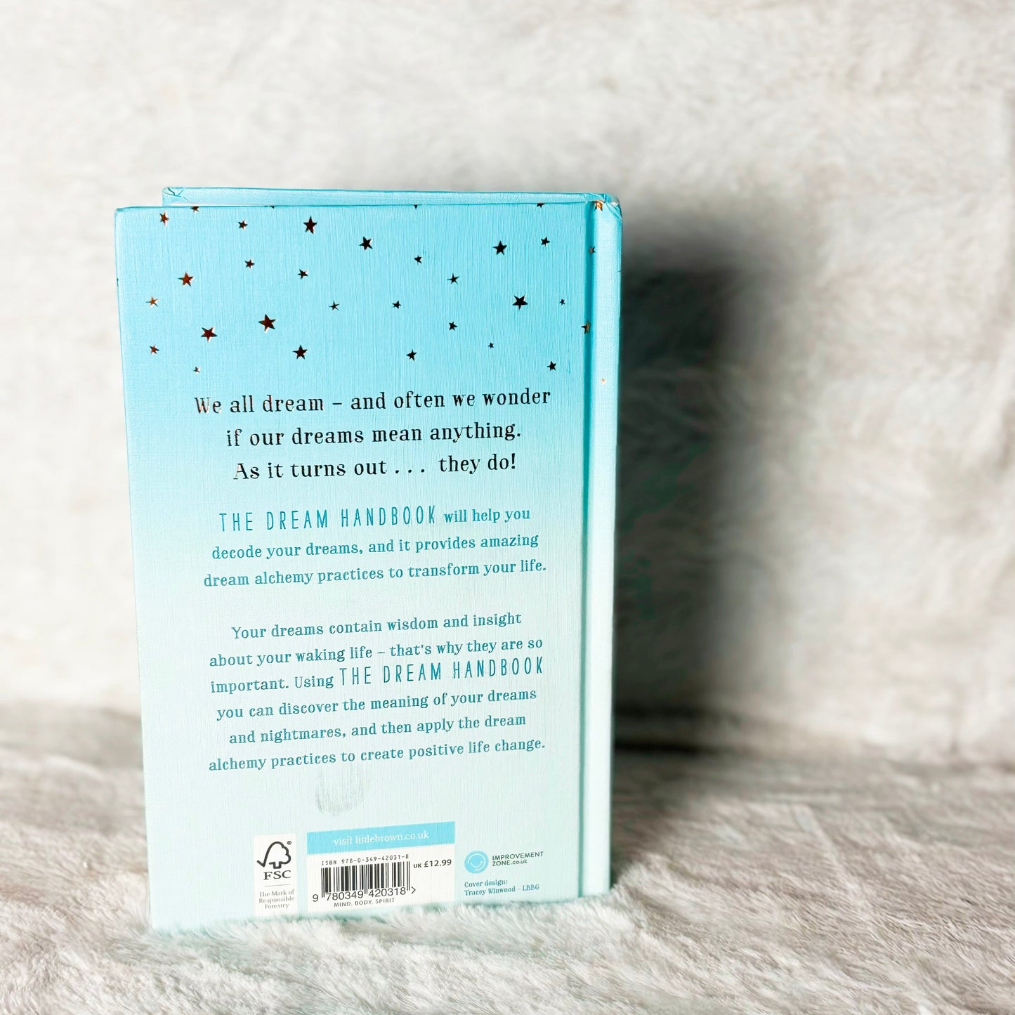 Book with text on a textured surface