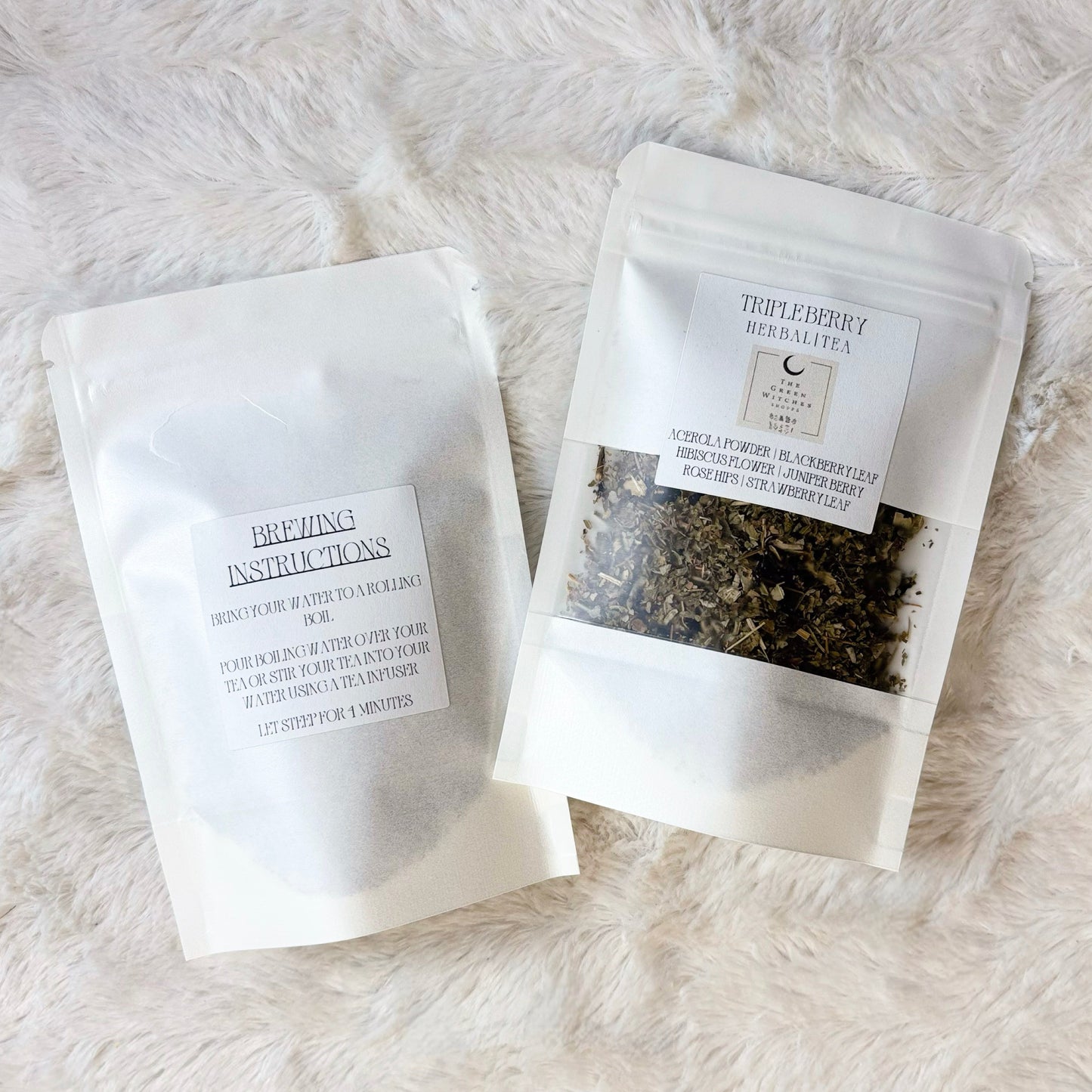 Two white packages with text on a white fluffy surface