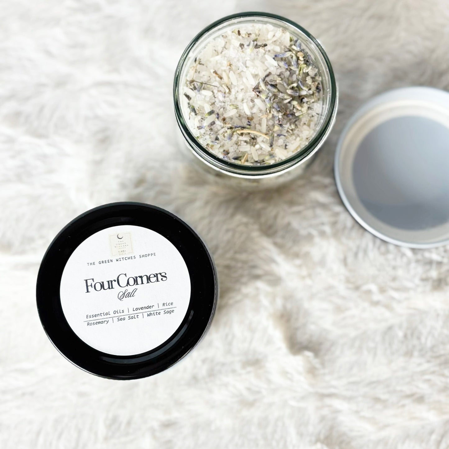 Two containers of Four Corners Salt on a white fluffy surface