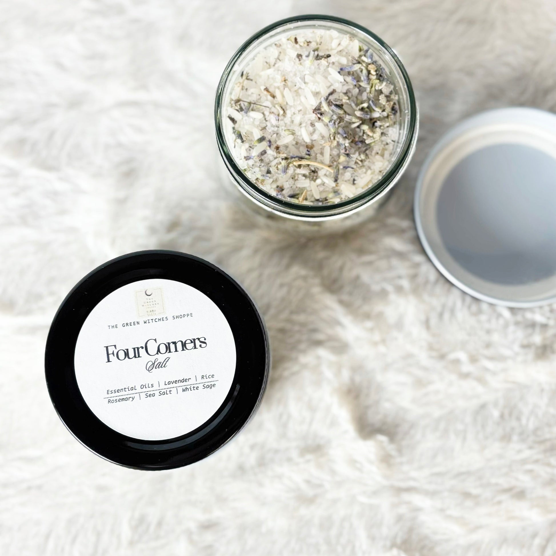 Two containers of Four Corners Salt on a white fluffy surface
