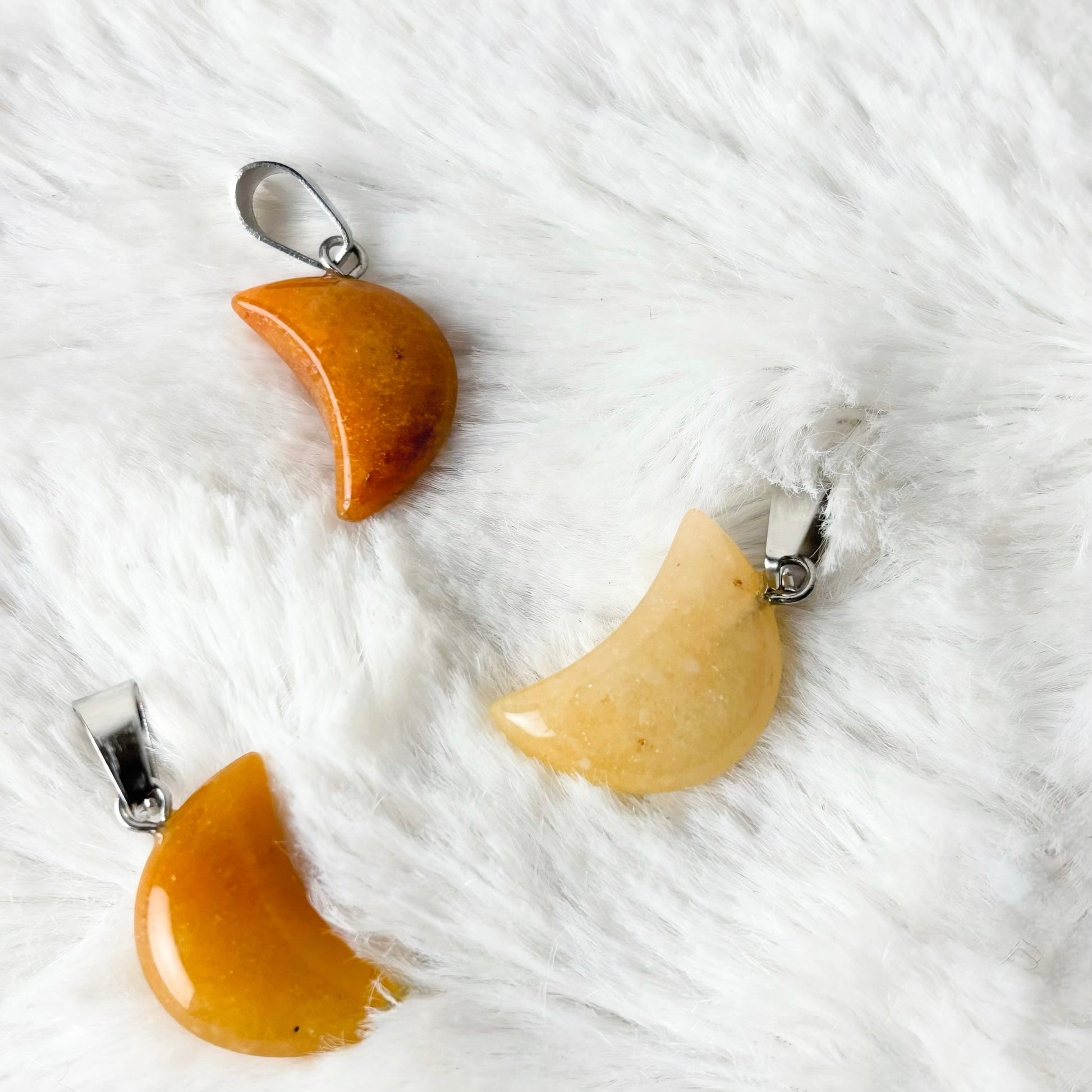 Orange crescent moons on a white background