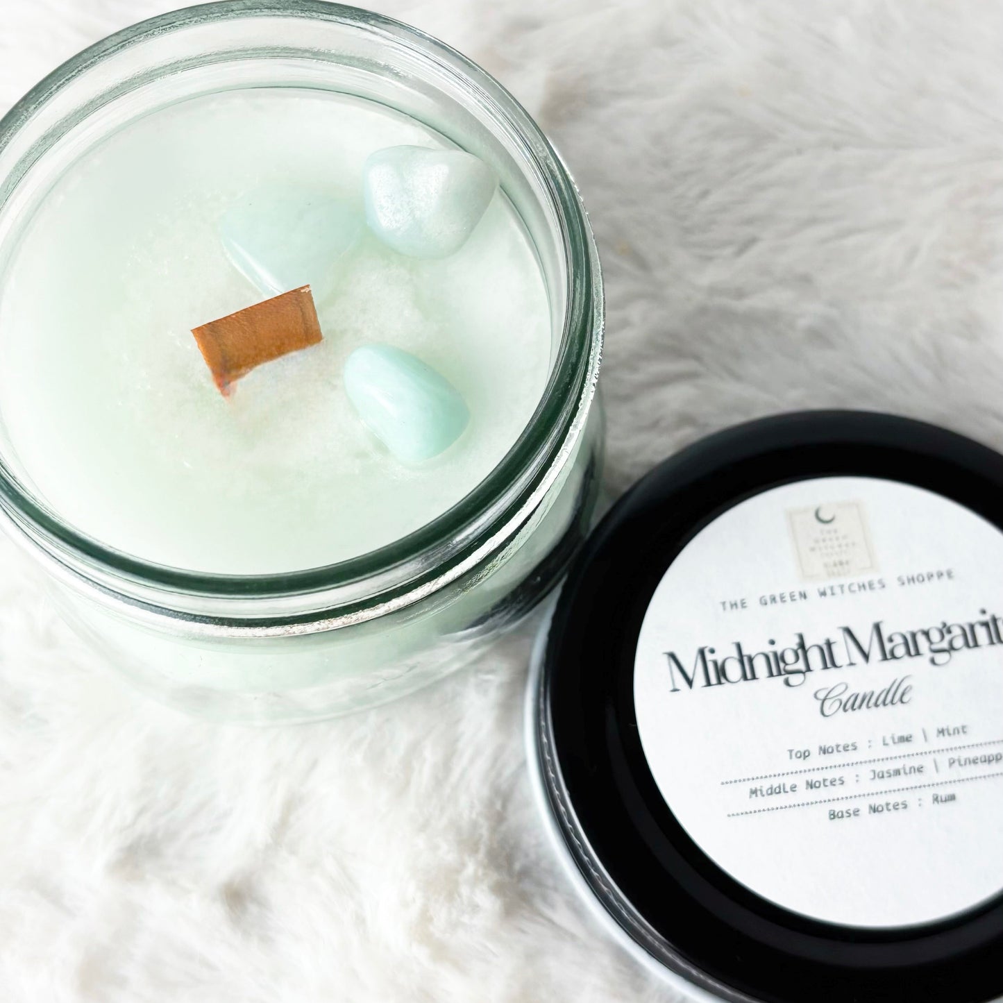 Candle with a label on a white surface