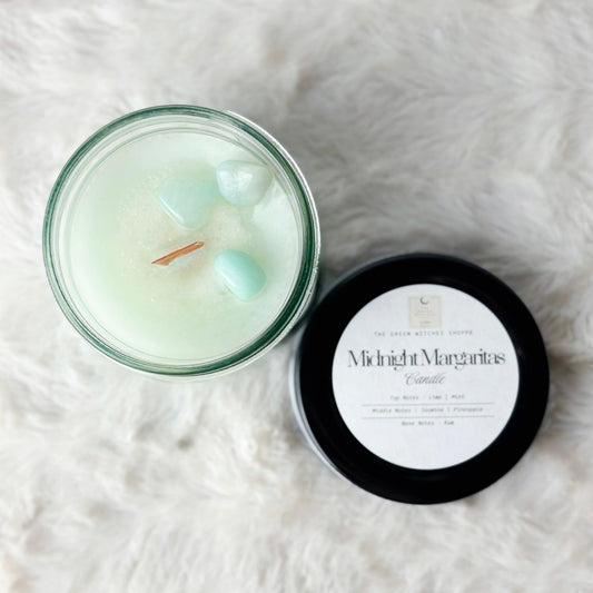 Candle with a label on a white textured surface
