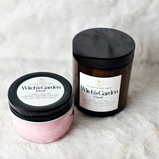 Two containers of 'Witch's Garden' on a white textured surface