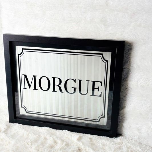 Framed sign with 'Morgue' text on a white background