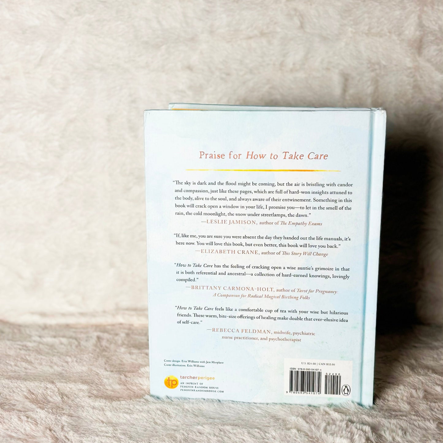 Back cover of a book on a textured beige surface