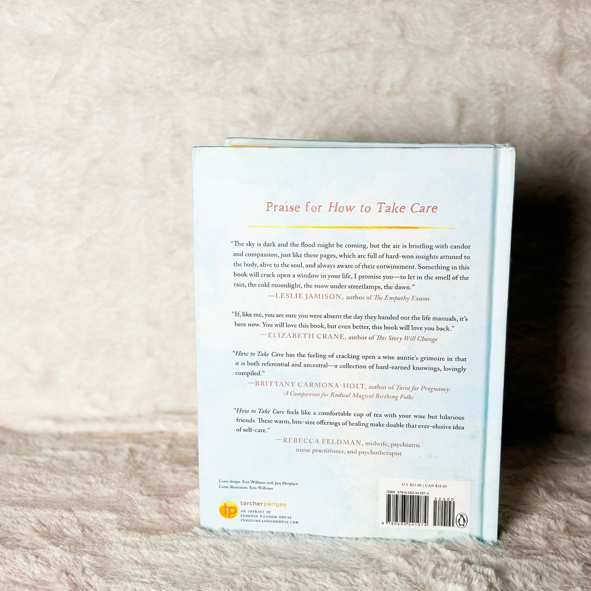Back cover of a book on a textured beige surface