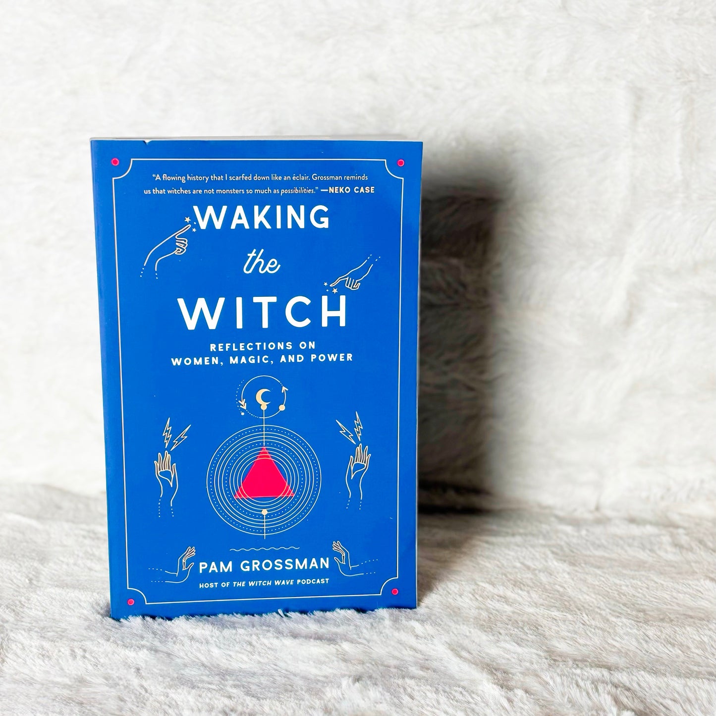 Book titled 'Waking the Witch' by Pam Grossman on a white textured surface