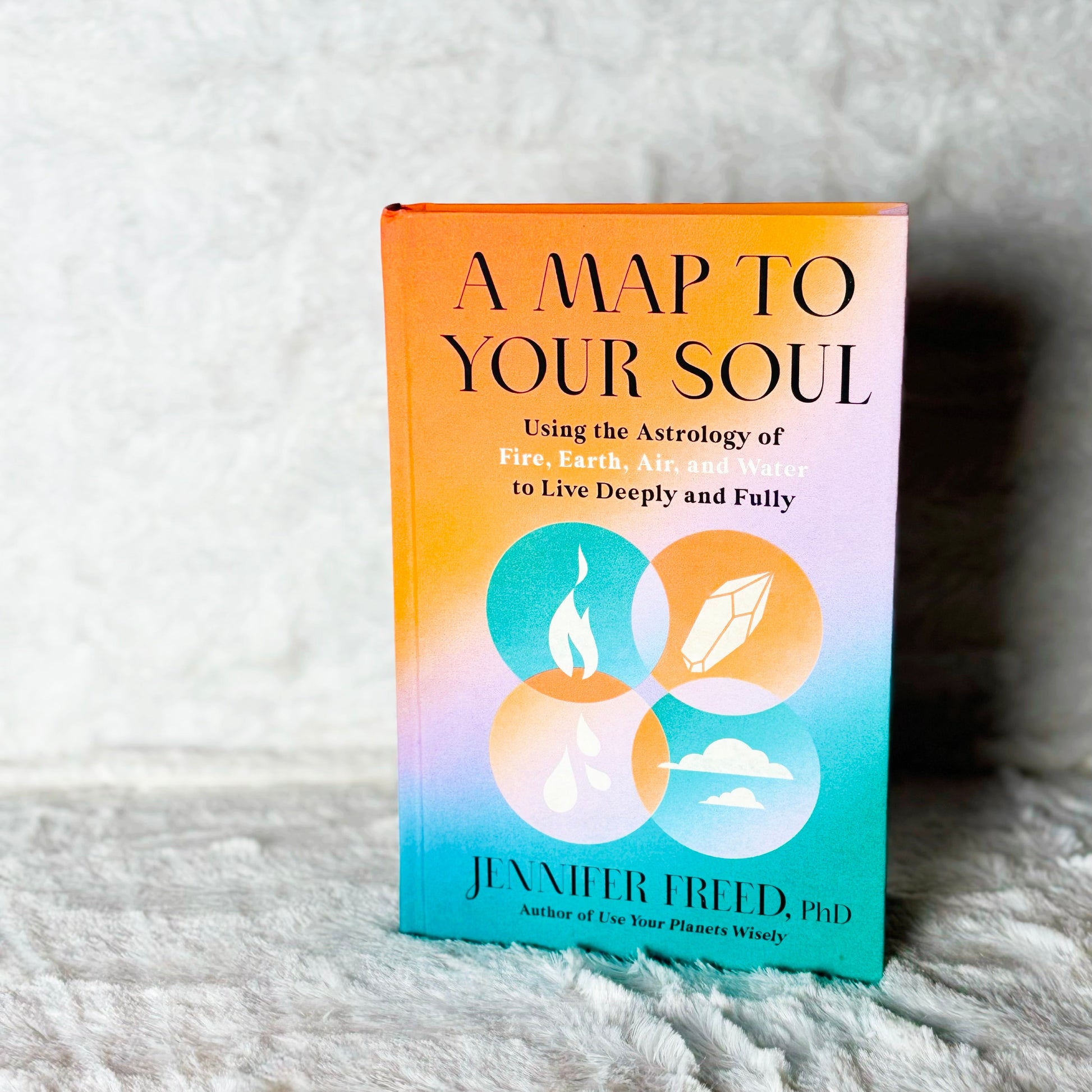 Book titled 'A Map to Your Soul' by Jennifer Freid on a textured surface