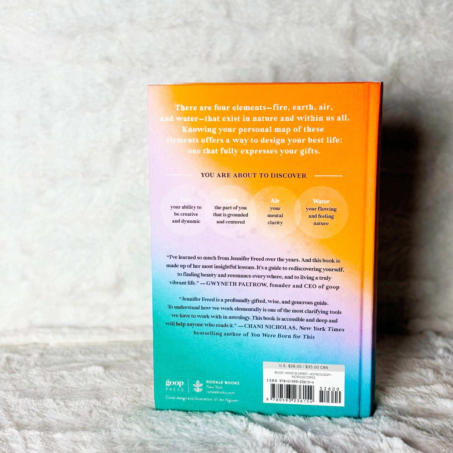 Book with a colorful back cover on a textured surface