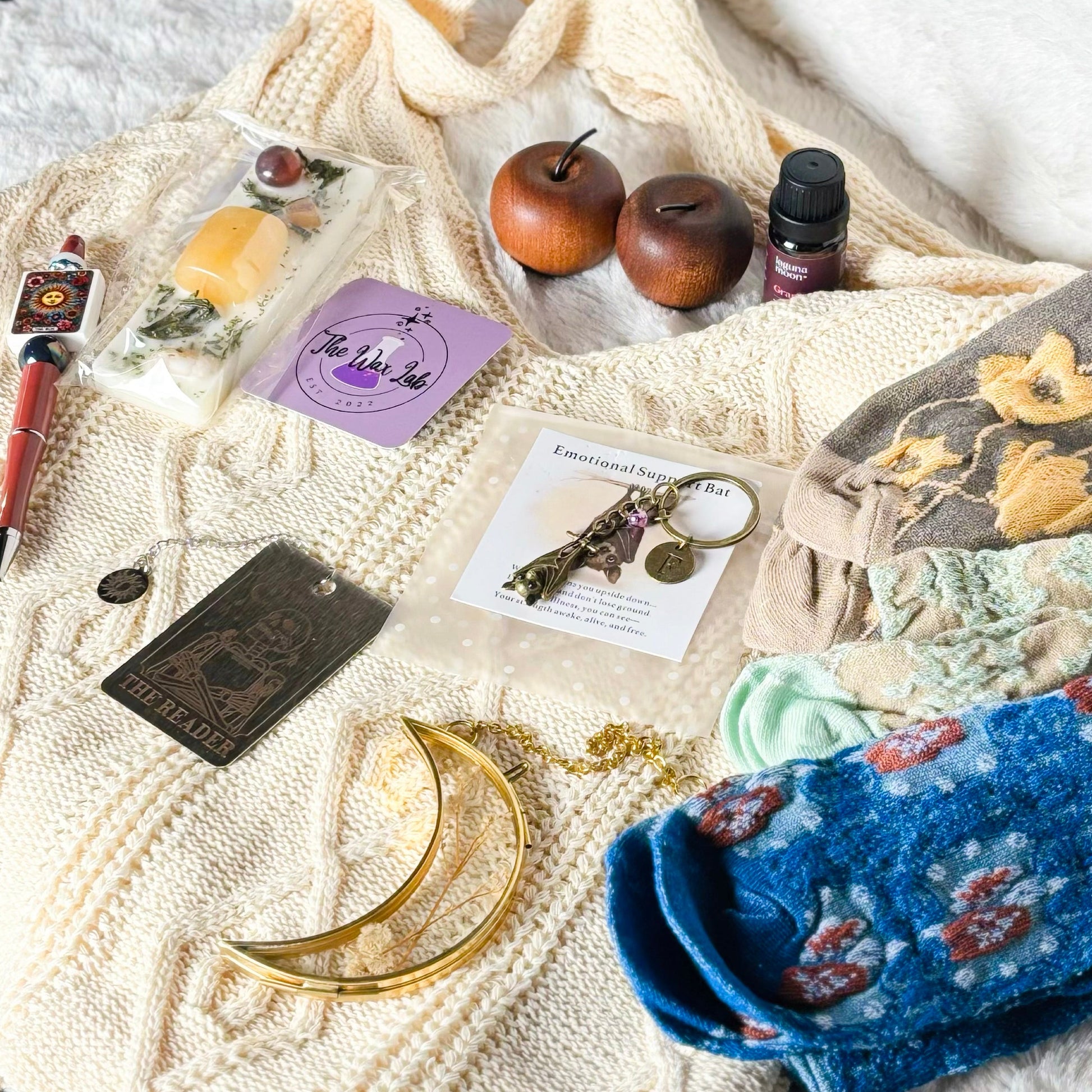 Collection of small items on a textured surface with a white background