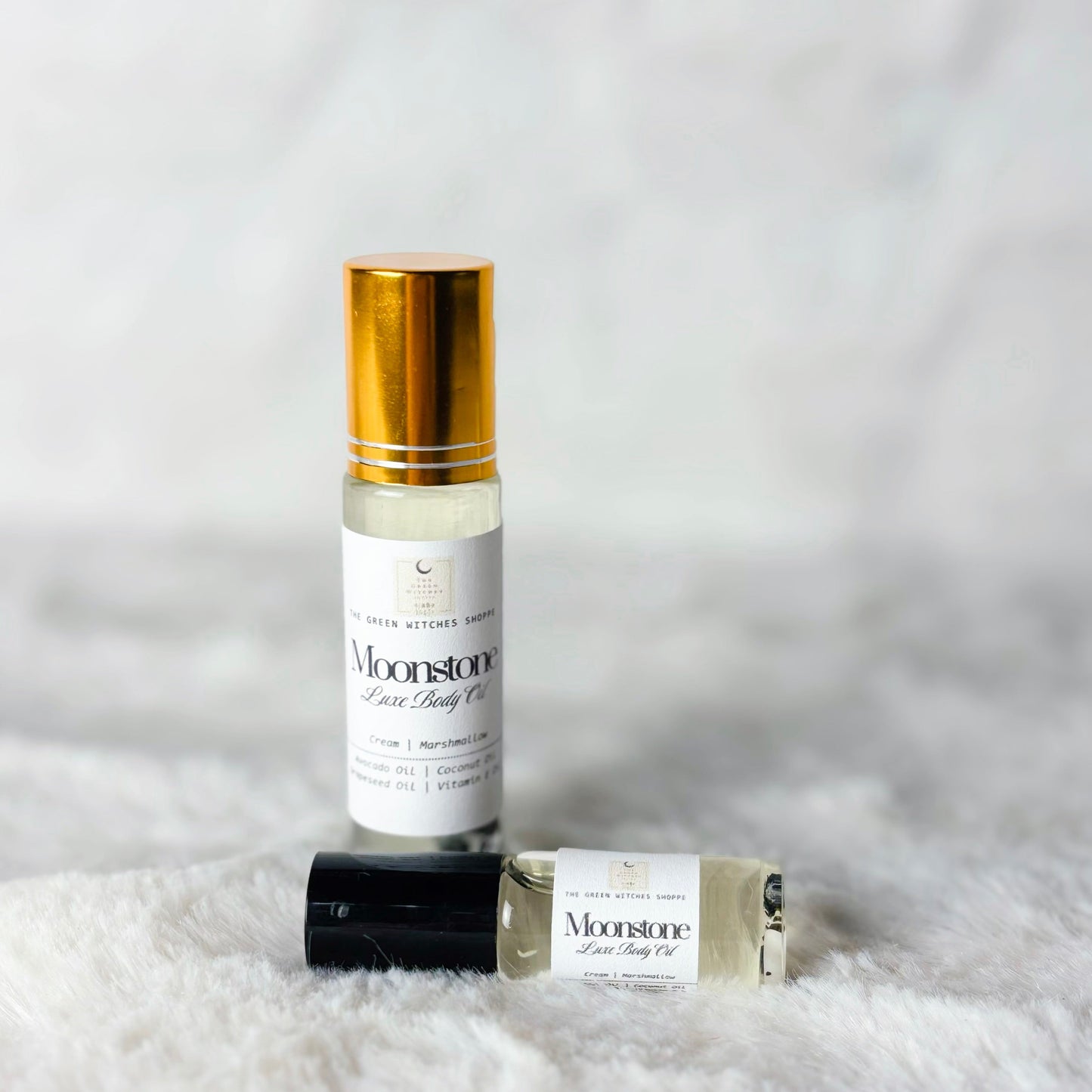 Bottles of body oil on a white background