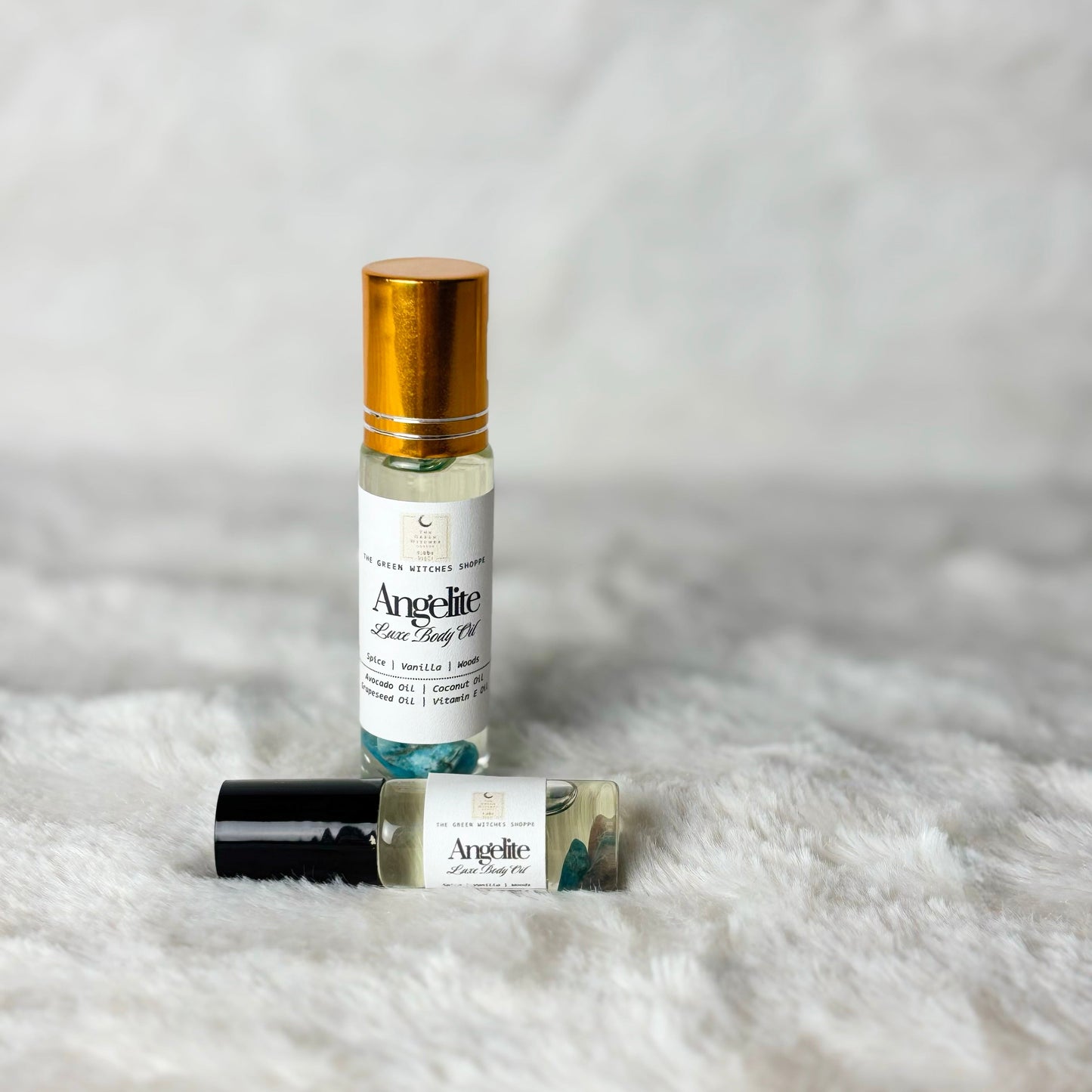 Bottles of body oil on a white background