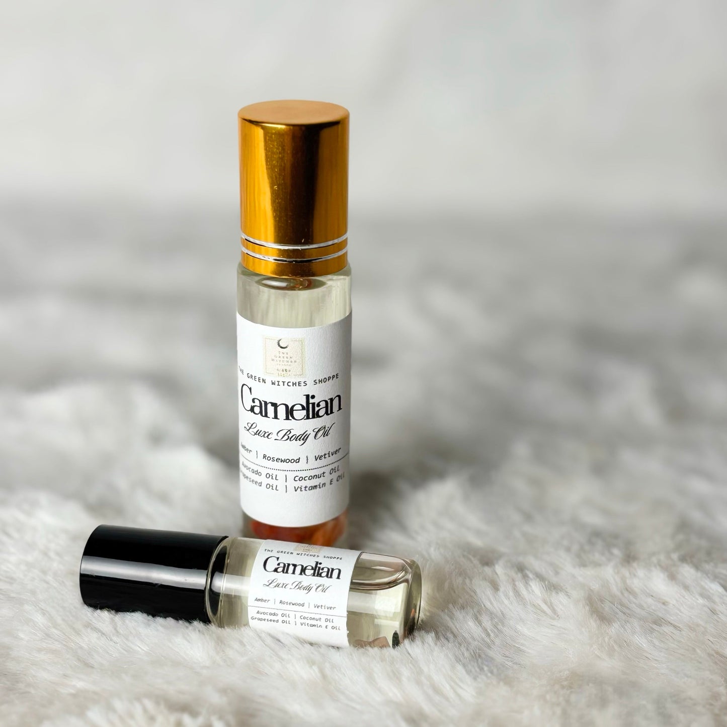 Bottles of body oil on a white background