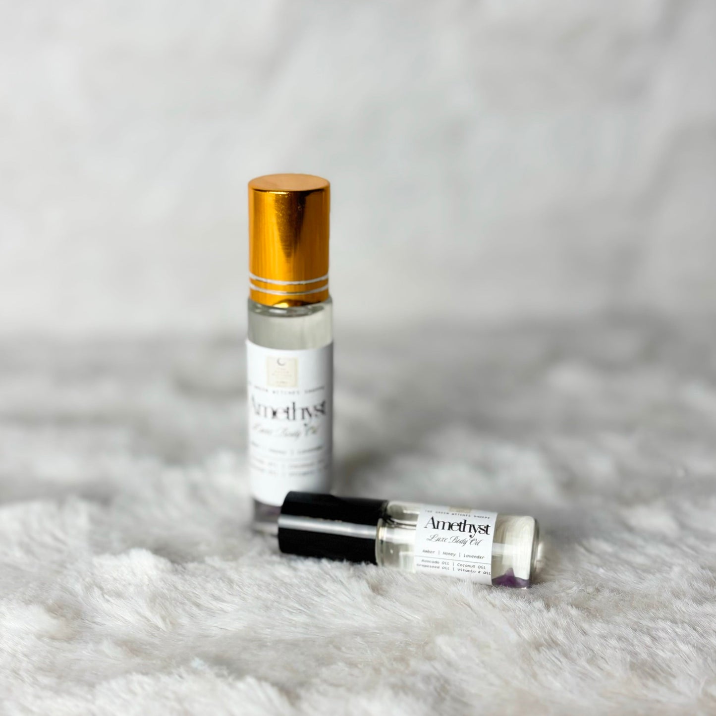 Bottles of body oil on a white background