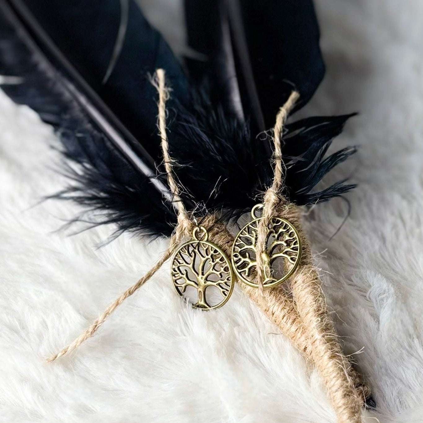 Decorative feather with decorative element on a white textured background