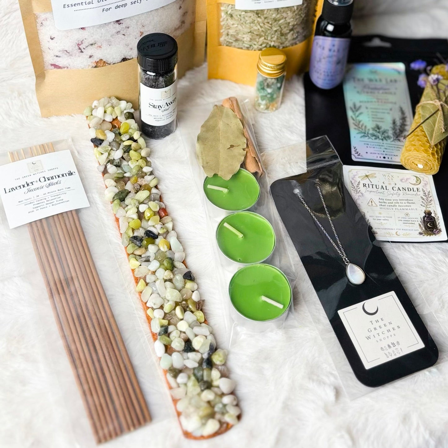Collection of wellness and self-care items on a textured surface with a moon-shaped decoration.