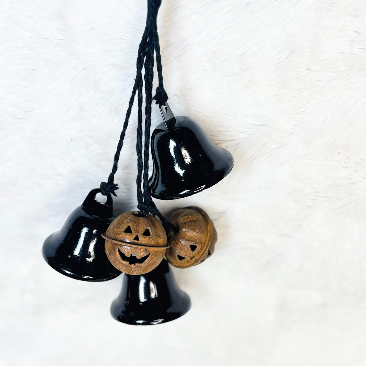 Black bells and rusty metal pumpkin bells