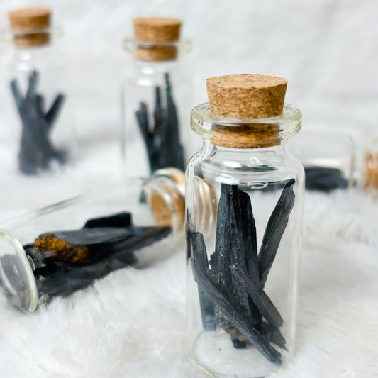 Vivianite shard jars on a white background
