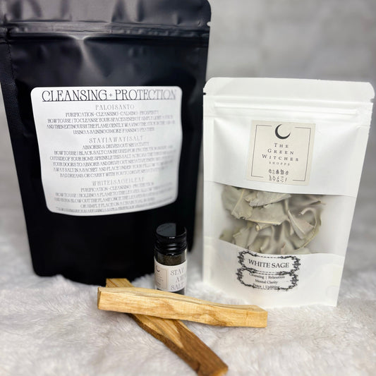 Two packages labeled 'Cleansing Protection' and 'White Sage' on a textured surface.